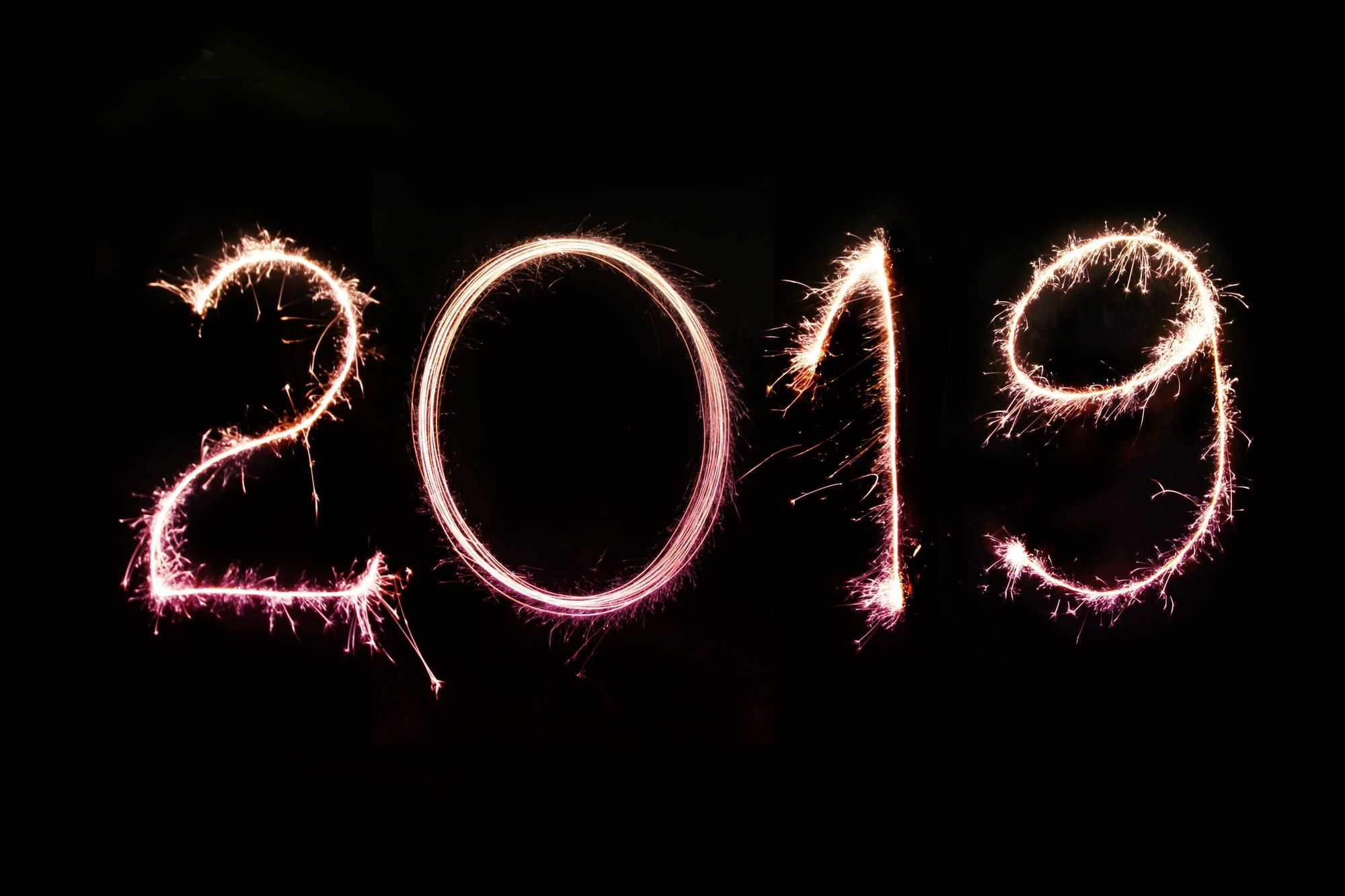 Long exposure photo of the 2019 numbers created with sparklers on a pitch-black background. Perfect for 2019 greeting cards and newsletter e-mails, personal and business social media & blog posts. 

More shots like this > https://www.shutterstock.com/g/pink+broccoli
Follow us on Instagram > https://www.instagram.com/nordwood
For fierce WordPress bloggers > https://themeforest.net/user/nordwood/portfolio