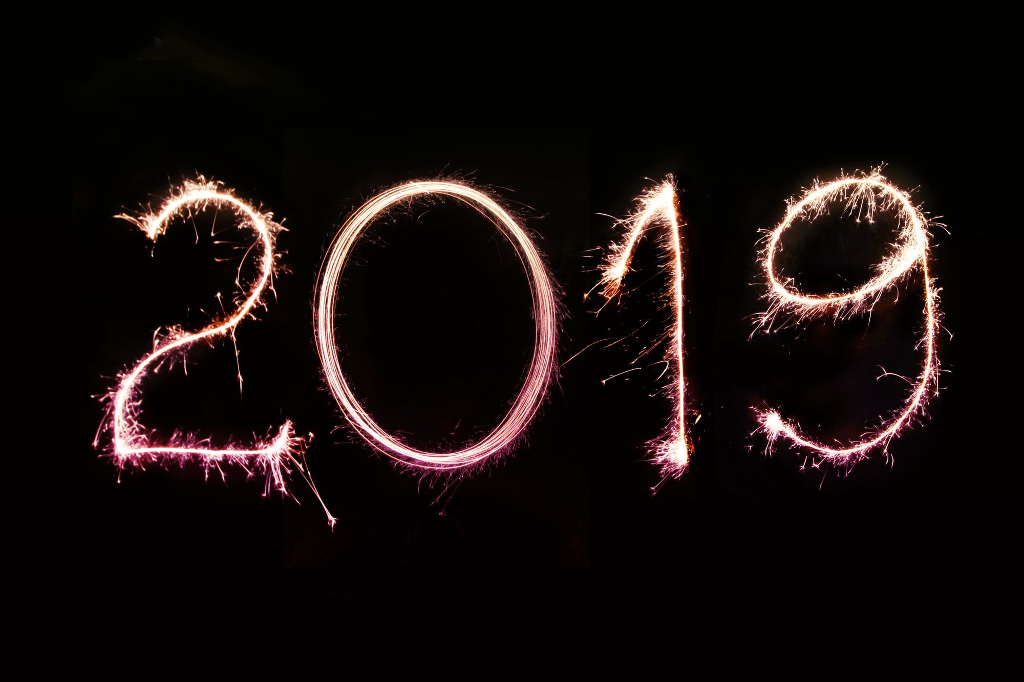 Long exposure photo of the 2019 numbers created with sparklers on a pitch-black background. Perfect for 2019 greeting cards and newsletter e-mails, personal and business social media & blog posts. 

More shots like this > https://www.shutterstock.com/g/pink+broccoli
Follow us on Instagram > https://www.instagram.com/nordwood
For fierce WordPress bloggers > https://themeforest.net/user/nordwood/portfolio