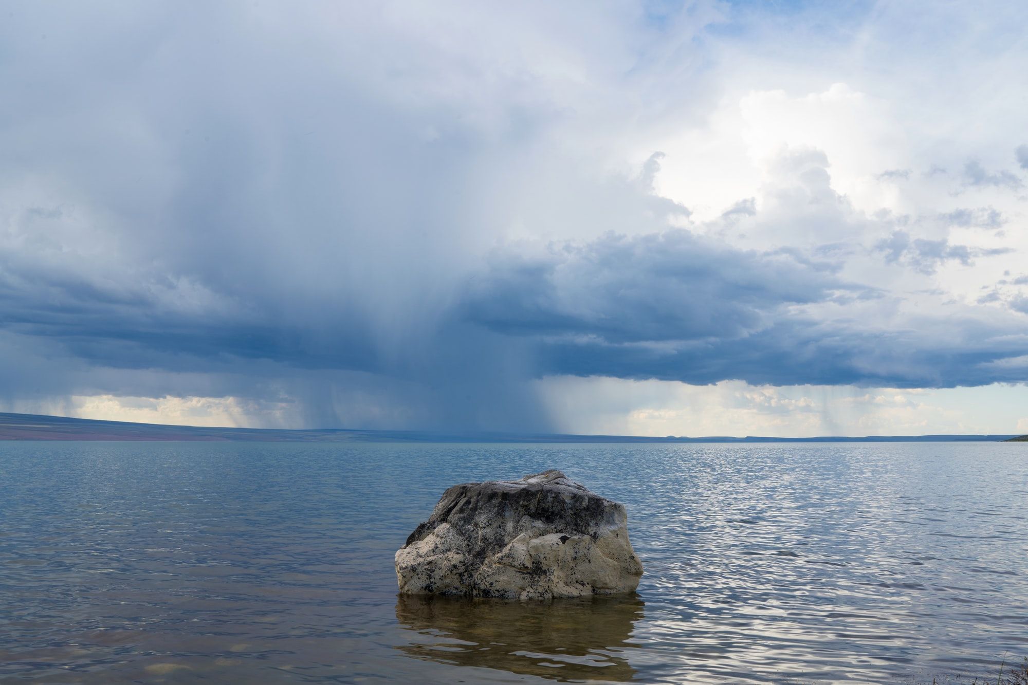 This is my favorite photo that Unsplash deemed unsearchable. It’s a seldom-visited location and strange bit of geology. This is remote Lake Abert in southern Oregon. It’s what remains of a massive lake that formed at the end of the ice age. There are no fish or recreational activities because of the saline/alkali content. The rocks along the shore are covered in this white crystallized mineral crust and I saw this lone rock sticking out near the shore as rain poured in the distance. 