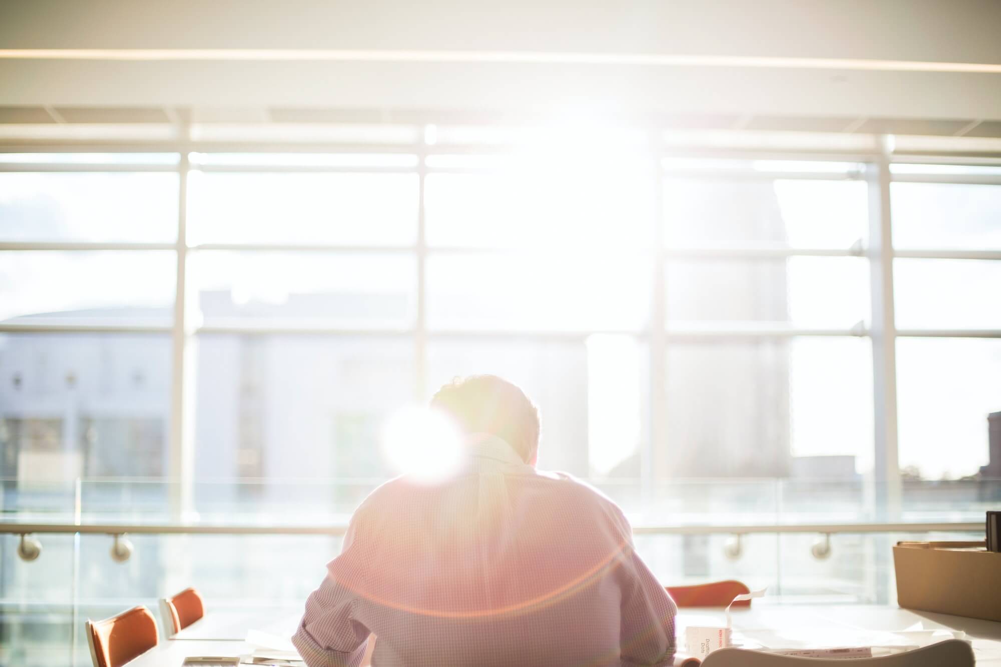 man reading in office