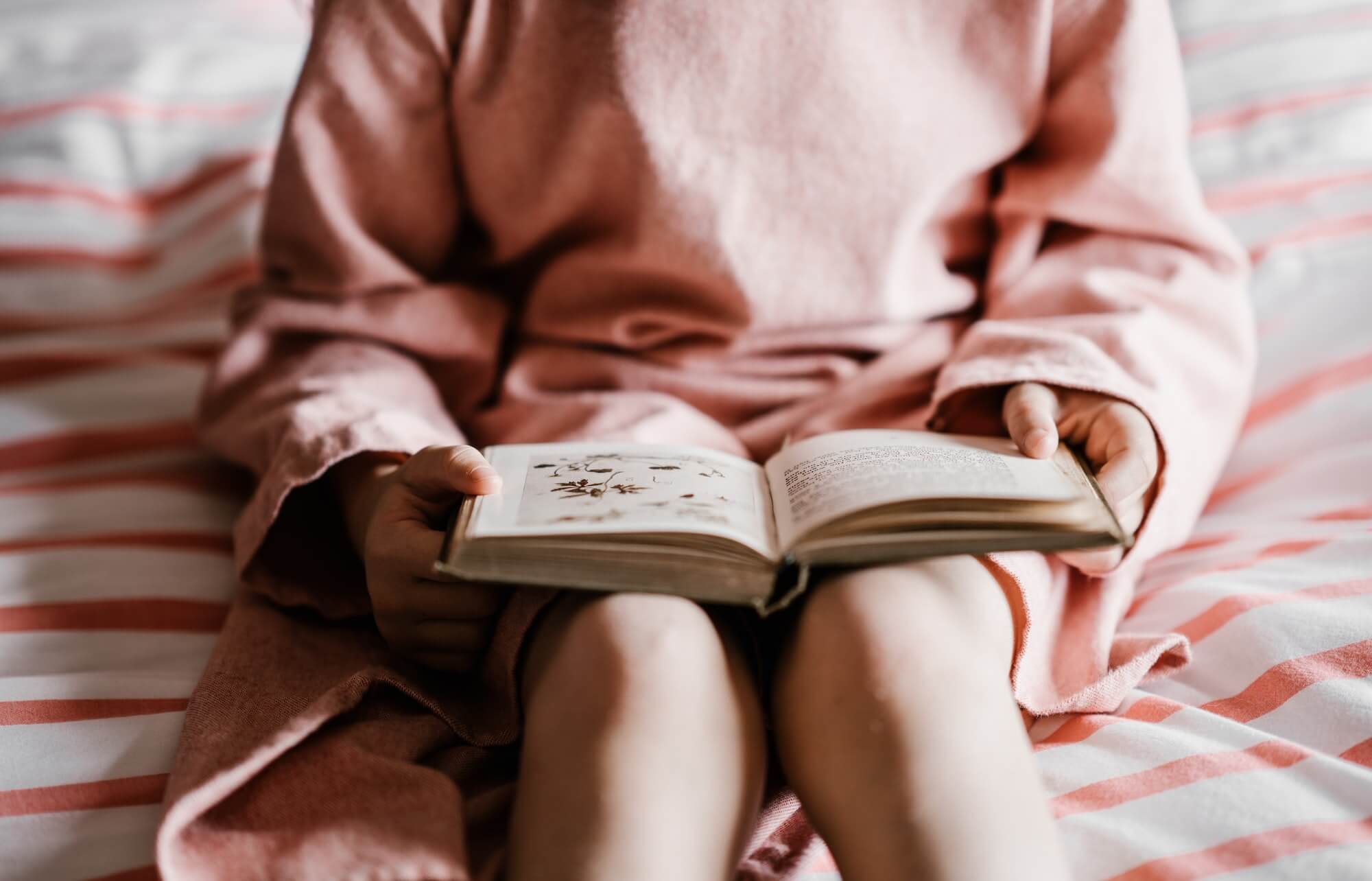 Girl reading a bedtime story book